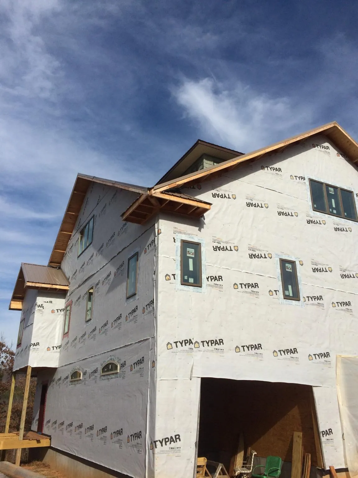 Stick built house wrapped in Typar with new roof framing and dormers in Hugo
